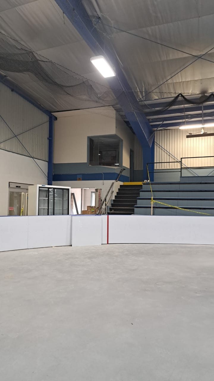 Arena end wall with spectator stands and upper booth, Elora Community Centre